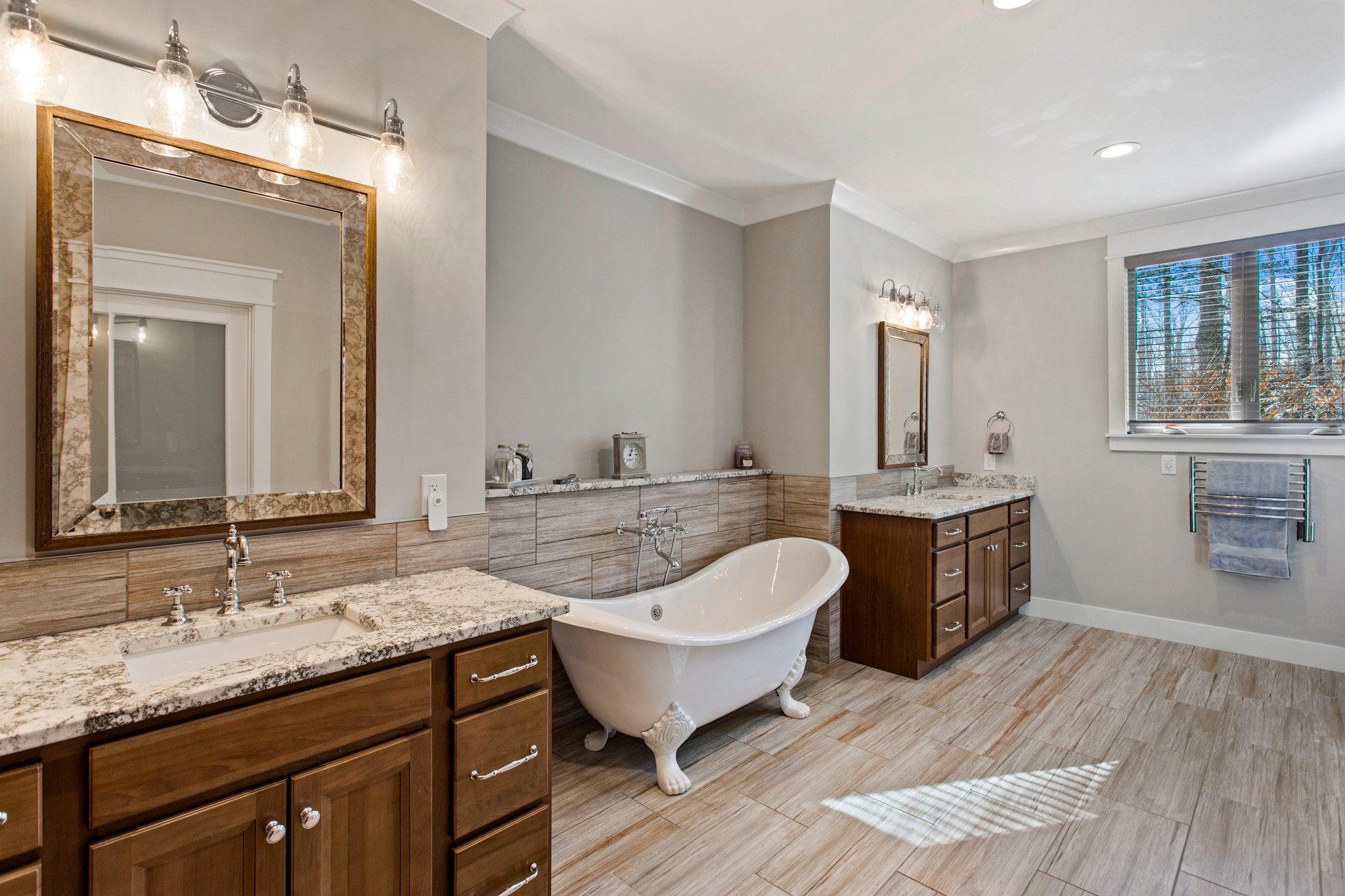 425 Puckett Road Murfreesboro, TN 37128 - Photo 17 of 44 a bathroom with a granite countertop tub a double vanity sink a mirror and a window