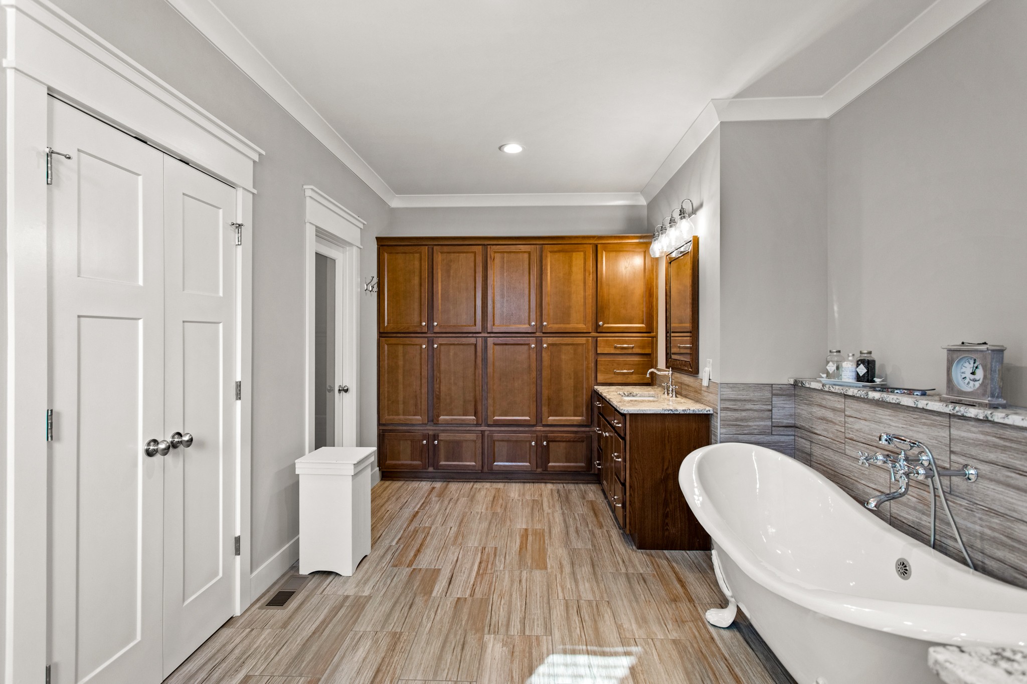 425 Puckett Road Murfreesboro, TN 37128 - Photo 19 of 44 a spacious bathroom with a double vanity sink a mirror and a bathtub