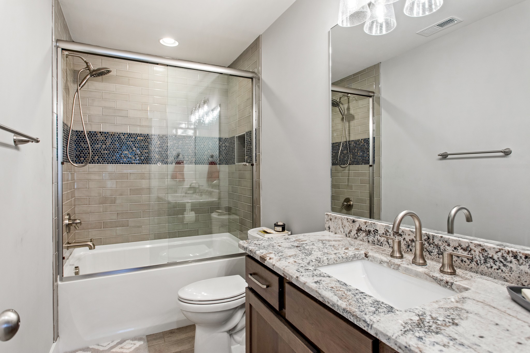 425 Puckett Road Murfreesboro, TN 37128 - Photo 31 of 44 a bathroom with a granite countertop sink a toilet and shower