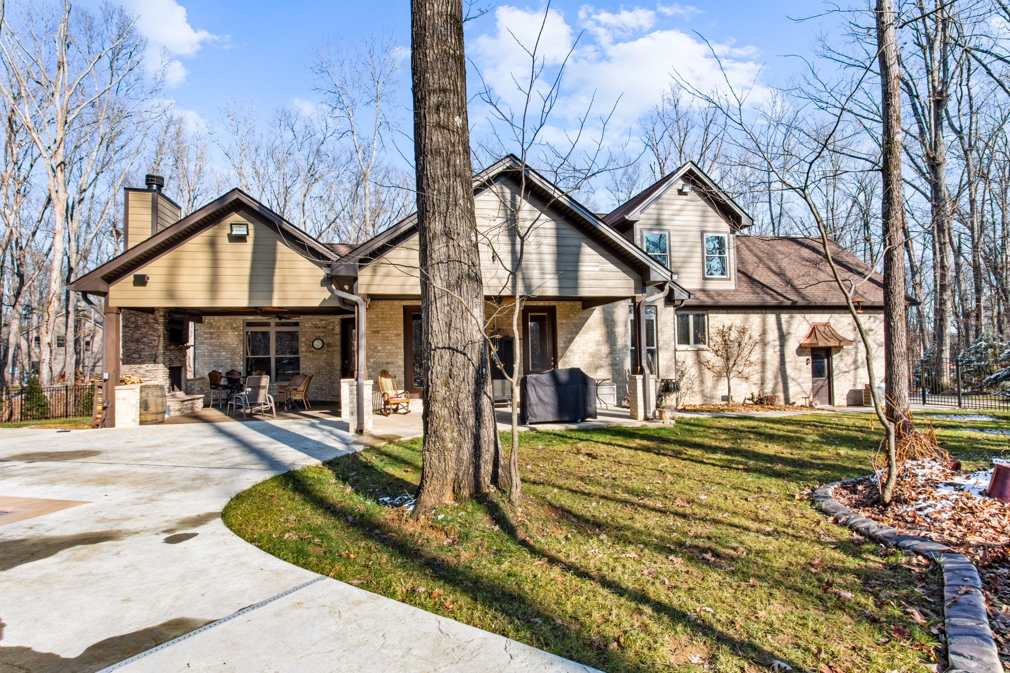 425 Puckett Road Murfreesboro, TN 37128 - Photo 40 of 44 a front view of a house with a yard table and chairs