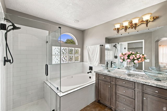 926 Ibis Way Draper, UT 84020 - Photo 15 of 41 Dual vanity with granite countertop, glass bowl sinks and elegant vanity. frameless glass shower, separate soaking tub with coordinated matte black fixtures.