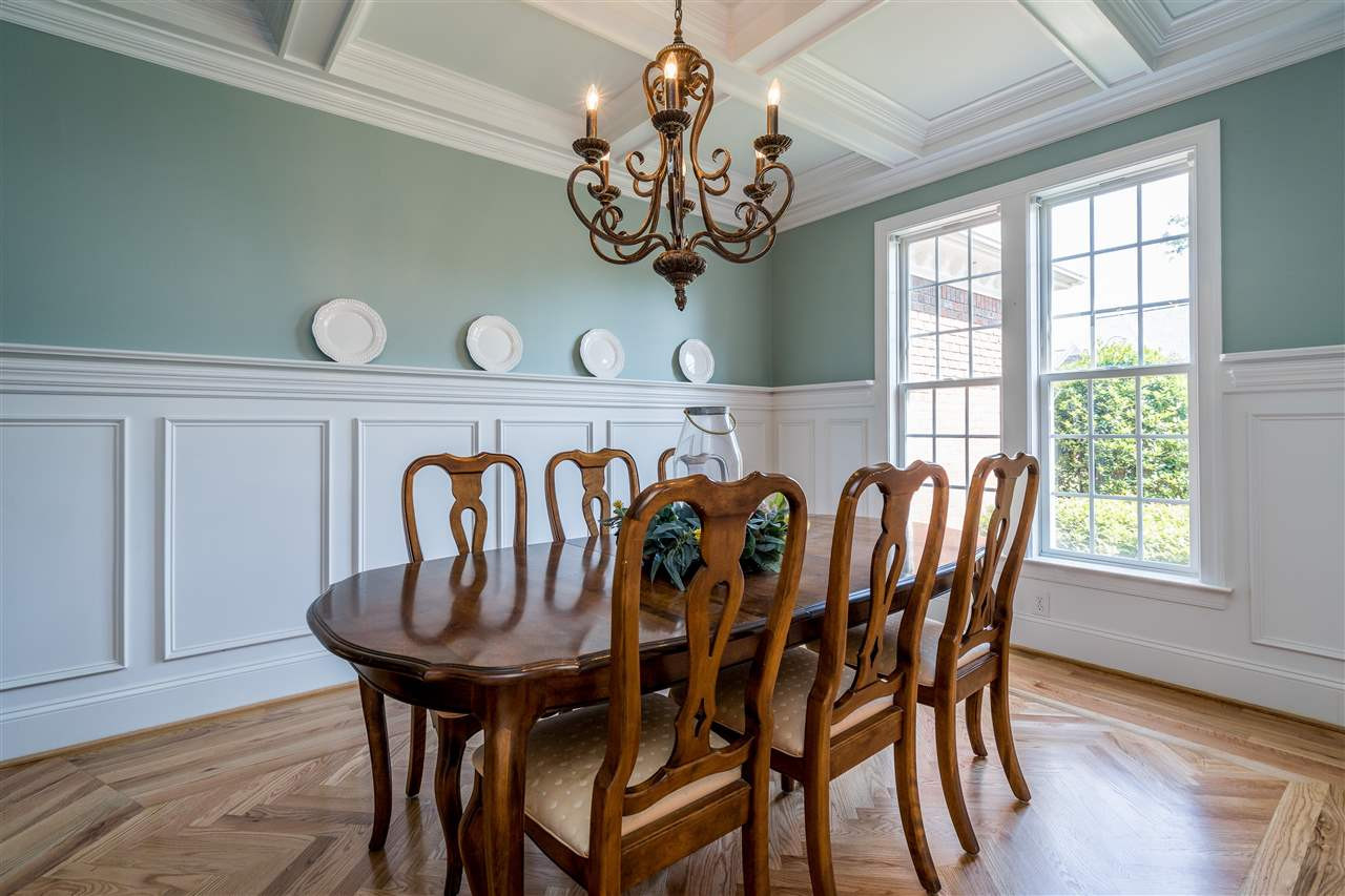 Gorgeous inlay in hardwood floors. Coffered ceiling. Amazing trim and detail with plate shelf. Dining Room