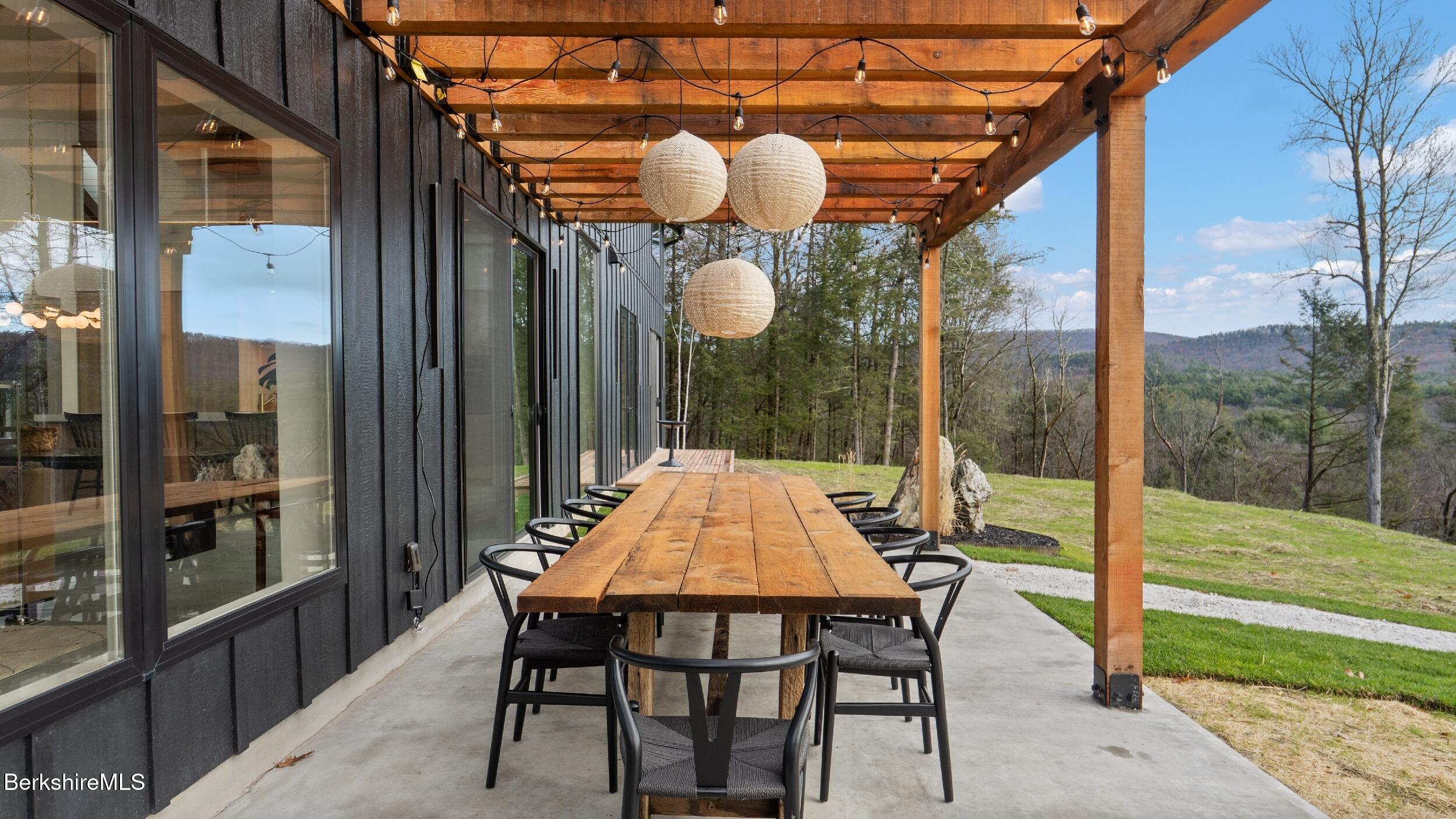 40 East Alford Road West Stockbridge, MA 01266 - Photo 16 of 51 a dining area with a table and chairs