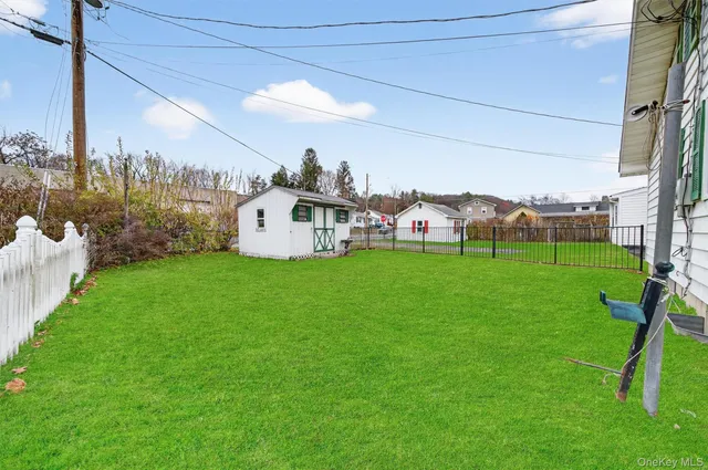 a view of a house with a backyard porch and sitting area