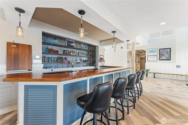 a kitchen with stainless steel appliances granite countertop a sink and cabinets