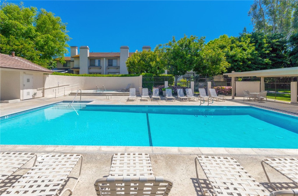 10 Sunshine, Unit 31 Irvine, CA 92603 - Photo 27 of 29 a view of a backyard with swimming pool and furniture