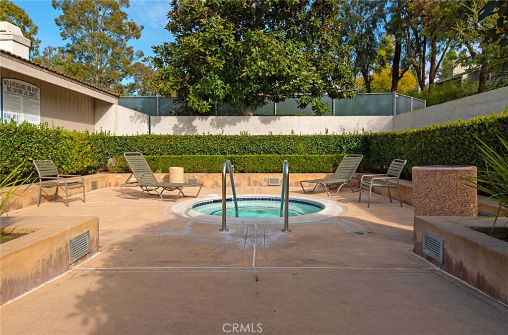 10 Sunshine, Unit 31 Irvine, CA 92603 - Photo 28 of 29 a view of a patio with a table and chairs