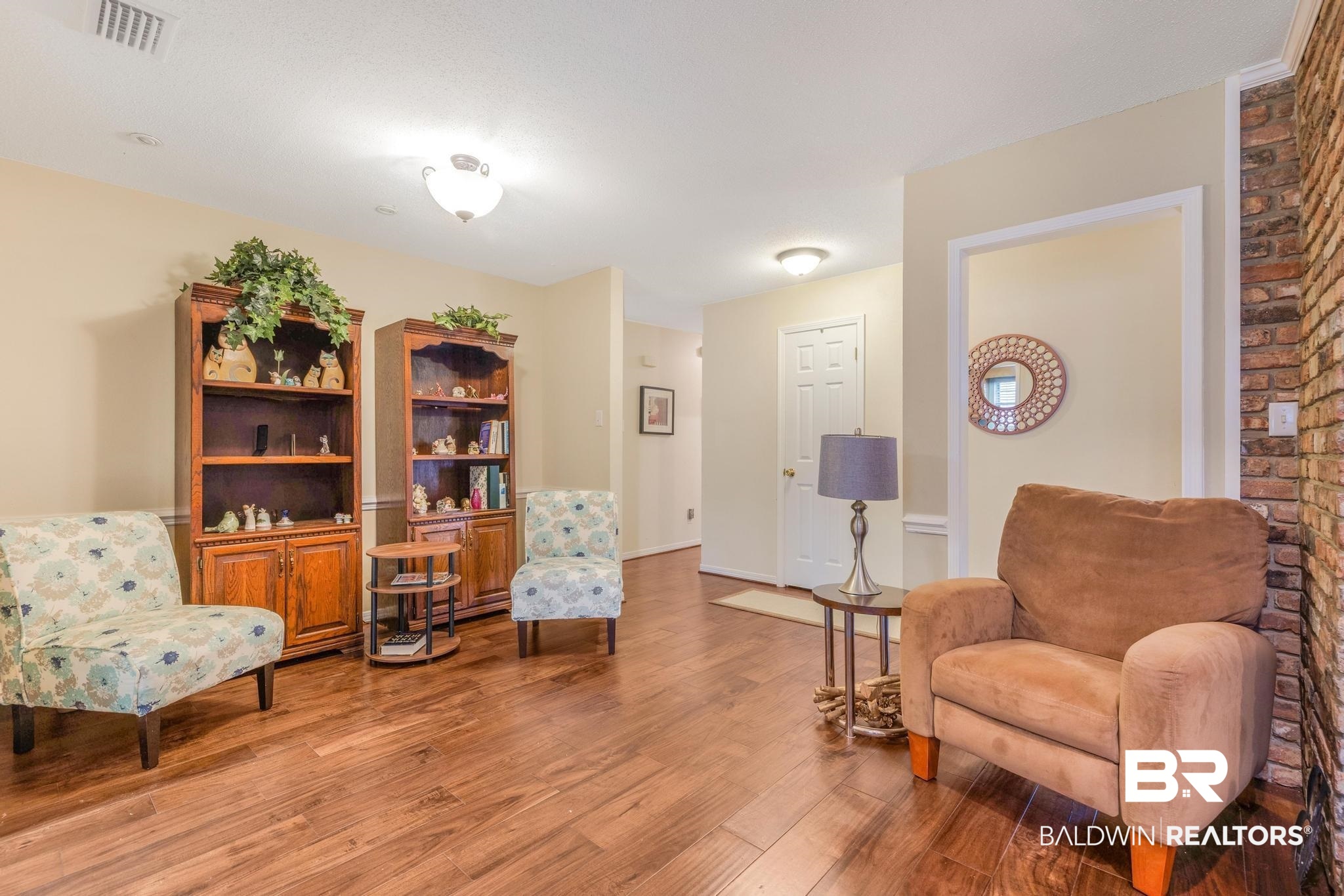 2573 E Road Mobile, AL 36693 - Photo 11 of 45 Living area with light wood-style flooring and baseboards