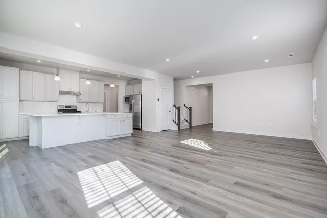 a view of kitchen view wooden floor and window