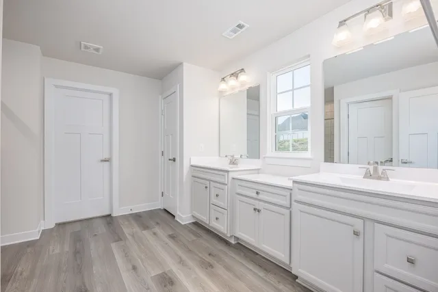 a bathroom with a glass shower door