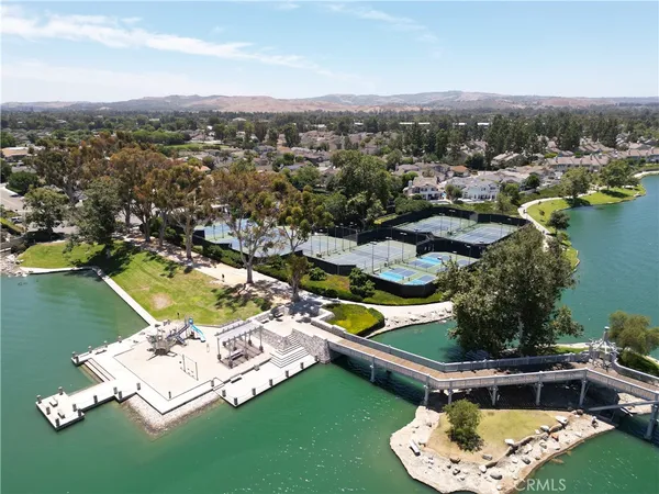 an aerial view of a house with a lake view