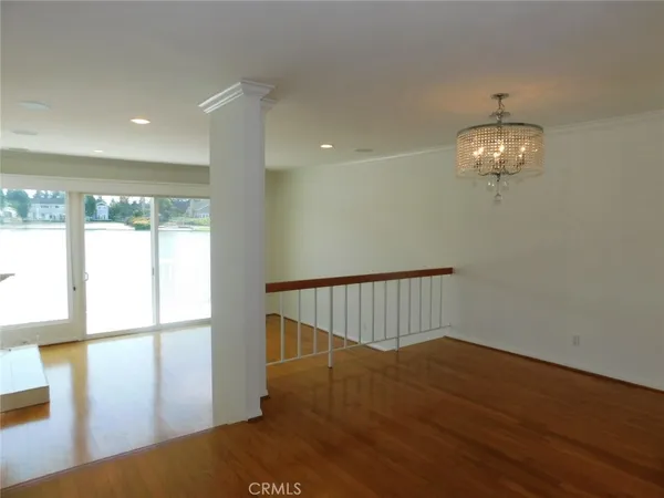 a view of a kitchen with a sink and refrigerator