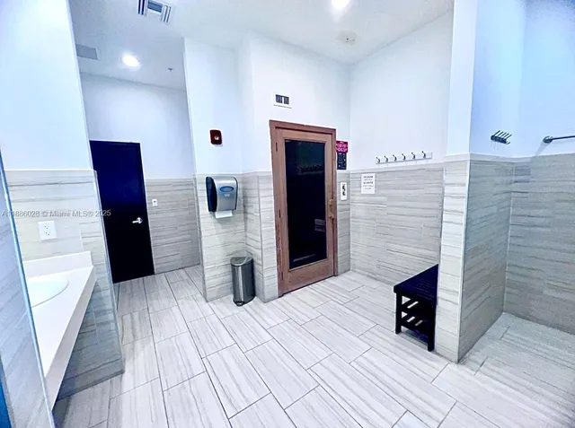 a spacious bathroom with a shower and a sink