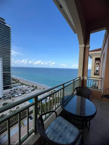 a view of a balcony dining area