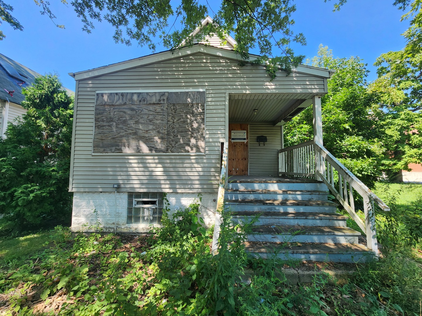 106 West 114th Street Chicago, IL 60628 - Photo 1 of 14 a view of a entrance gate of the house
