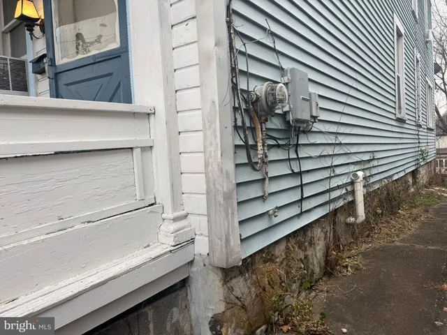 a view of wooden house with a large window