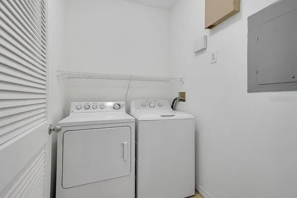 a utility room with dryer and washer
