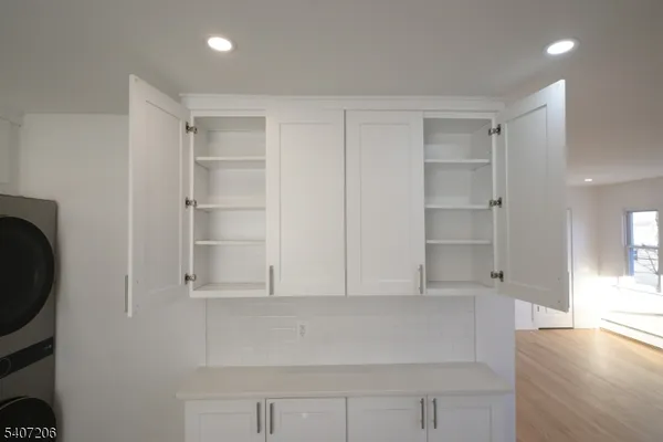 a view of walk in closet with empty racks