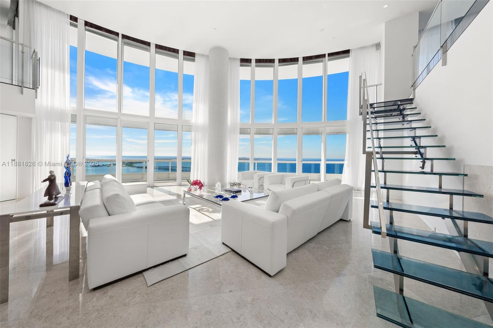 1643 Brickell Avenue, Unit 4102 Miami, FL 33129 - Photo 4 of 49 Living Room with custom designed glass and stainless steel staircase
