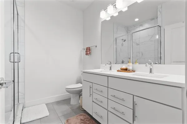 a bathroom with a glass shower door