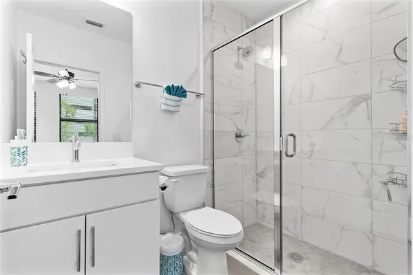 a kitchen with stainless steel appliances kitchen island a sink and cabinets