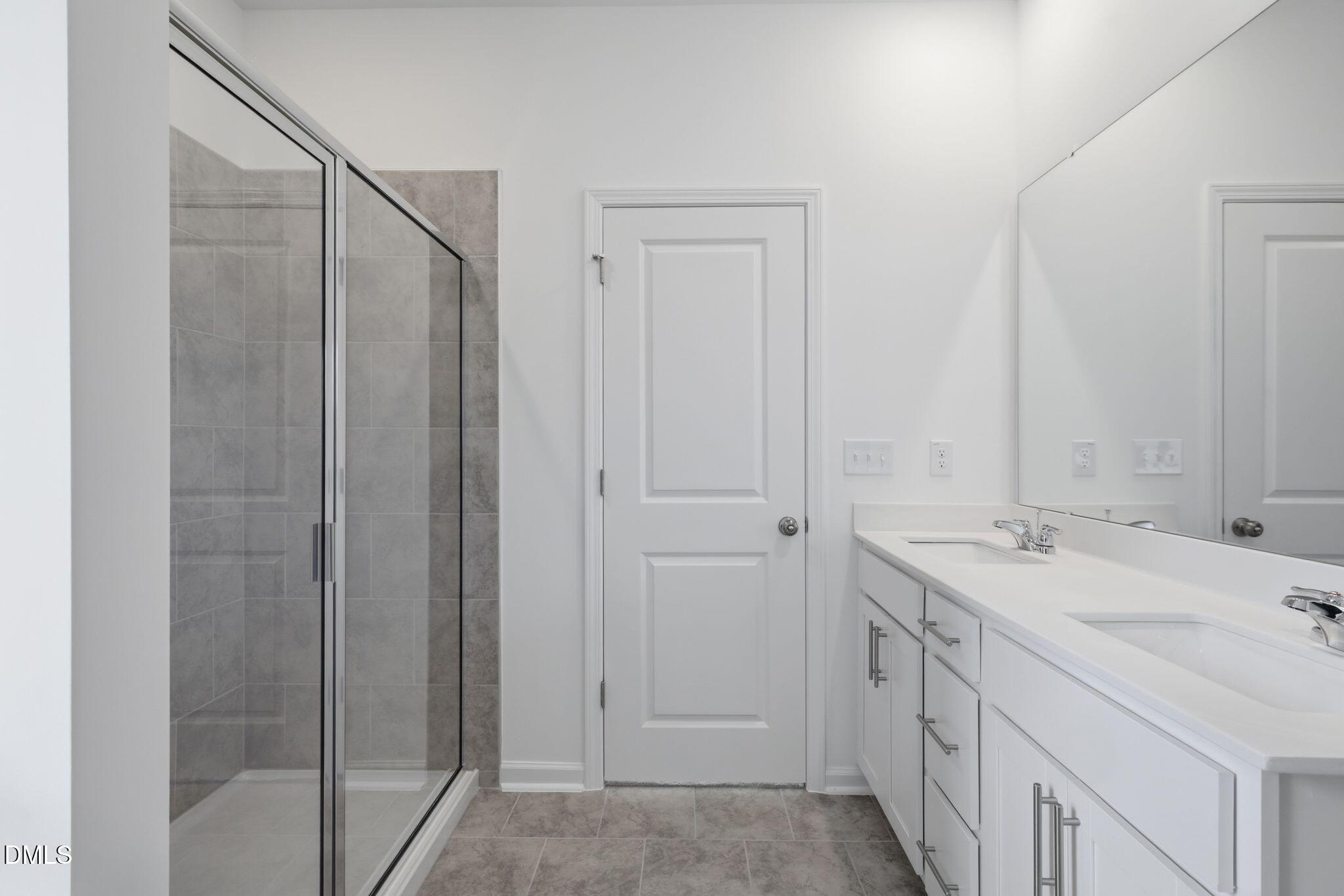 155 Digging Time Avenue Princeton, NC 27569 - Photo 21 of 29 a bathroom with a sink and mirror