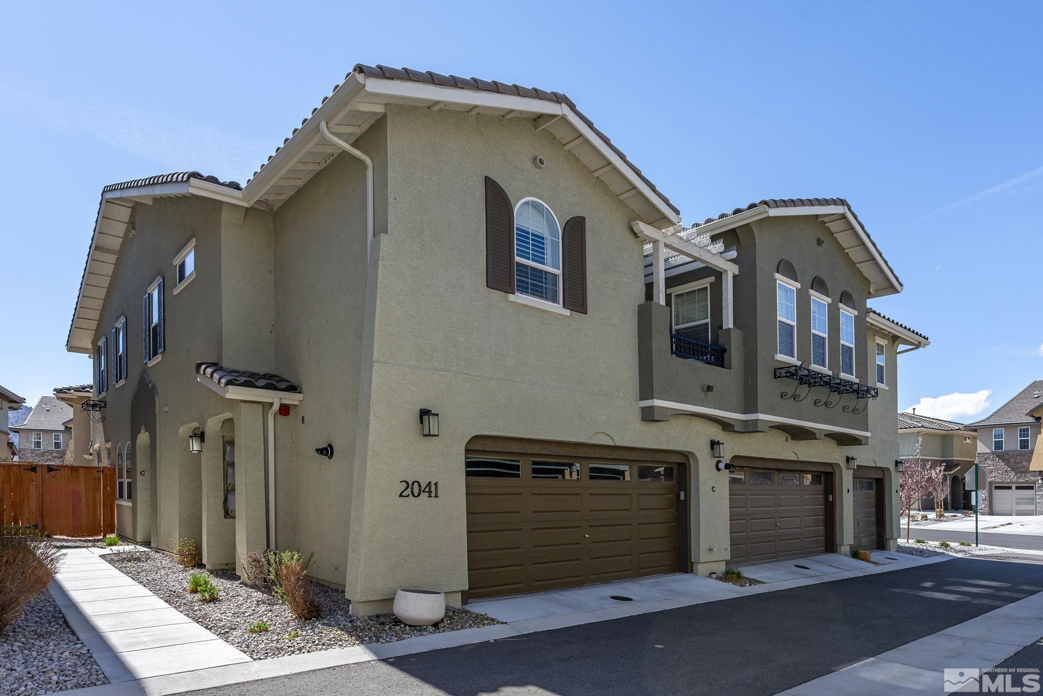 2041 Wind Ranch Road, Unit C Reno, NV 89521 - Photo 1 of 27 a front view of a house