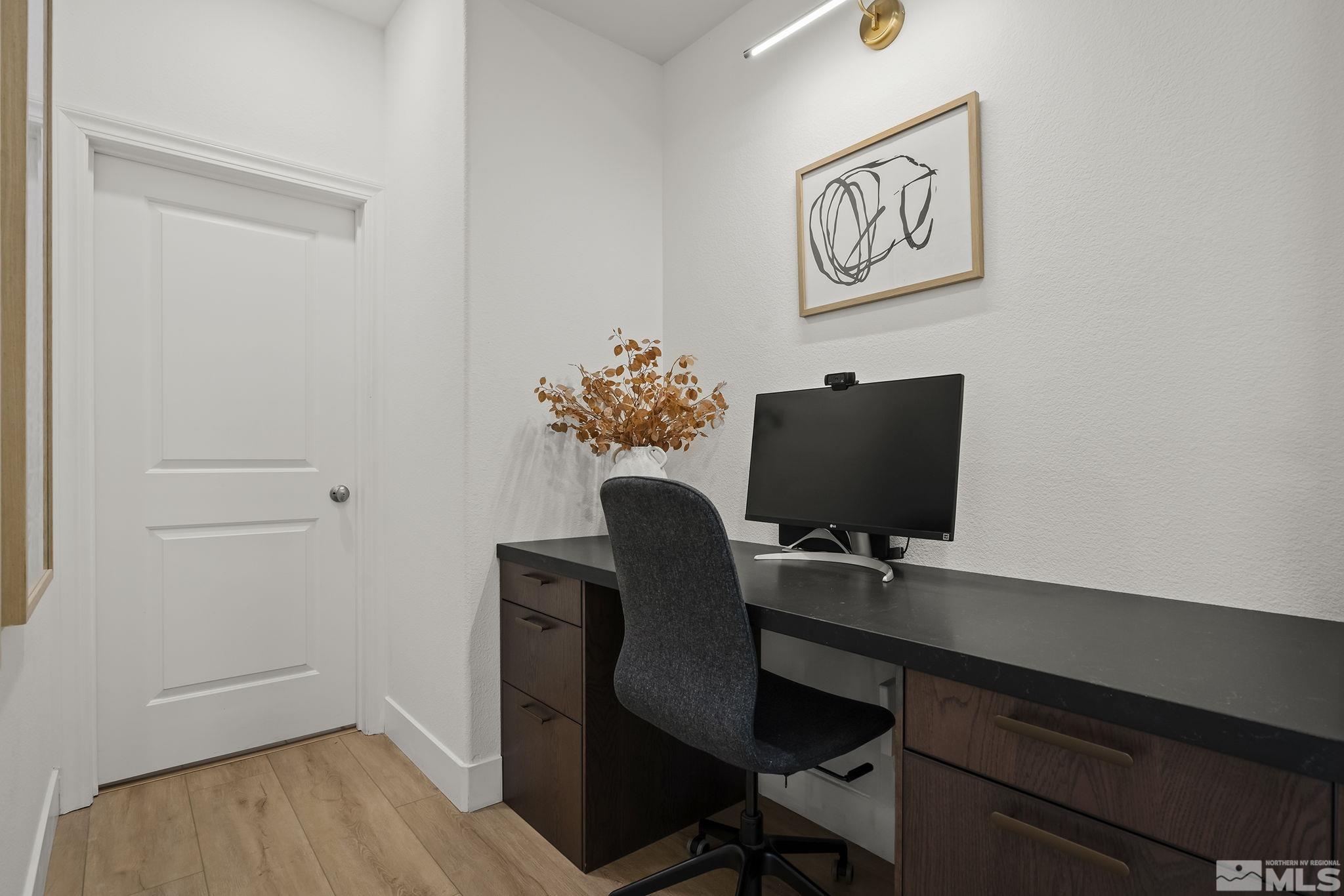 2041 Wind Ranch Road, Unit C Reno, NV 89521 - Photo 16 of 27 a workspace with furniture and wooden floor