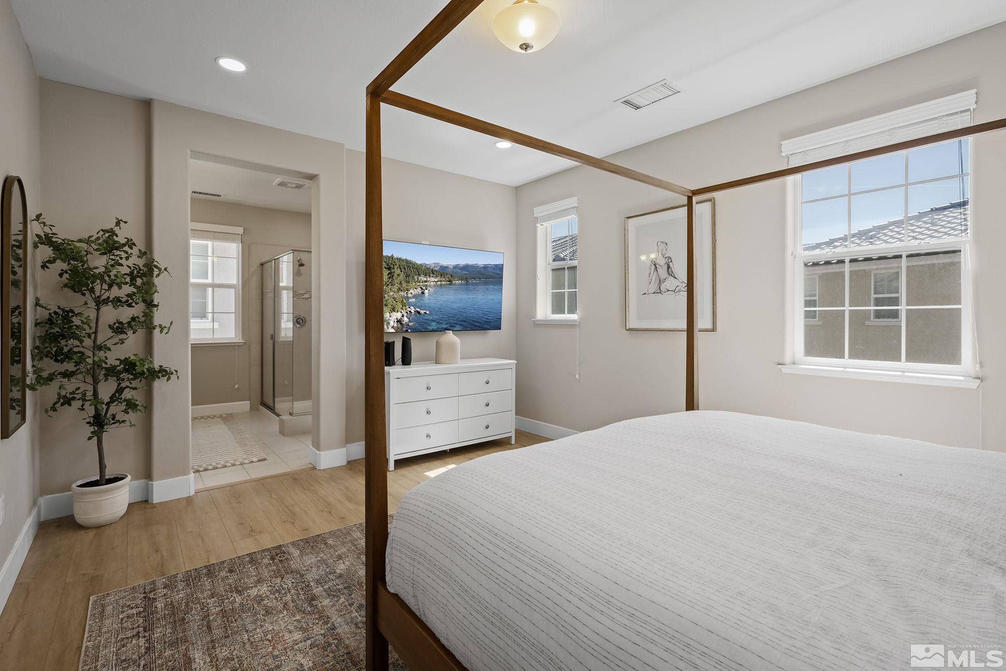 2041 Wind Ranch Road, Unit C Reno, NV 89521 - Photo 18 of 27 a bedroom with a bed and a window