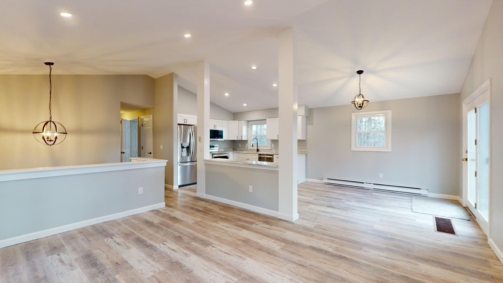 564 West Pelham Road Shutesbury, MA 01072 - Photo 15 of 40 a large kitchen with kitchen island a sink stainless steel appliances and cabinets