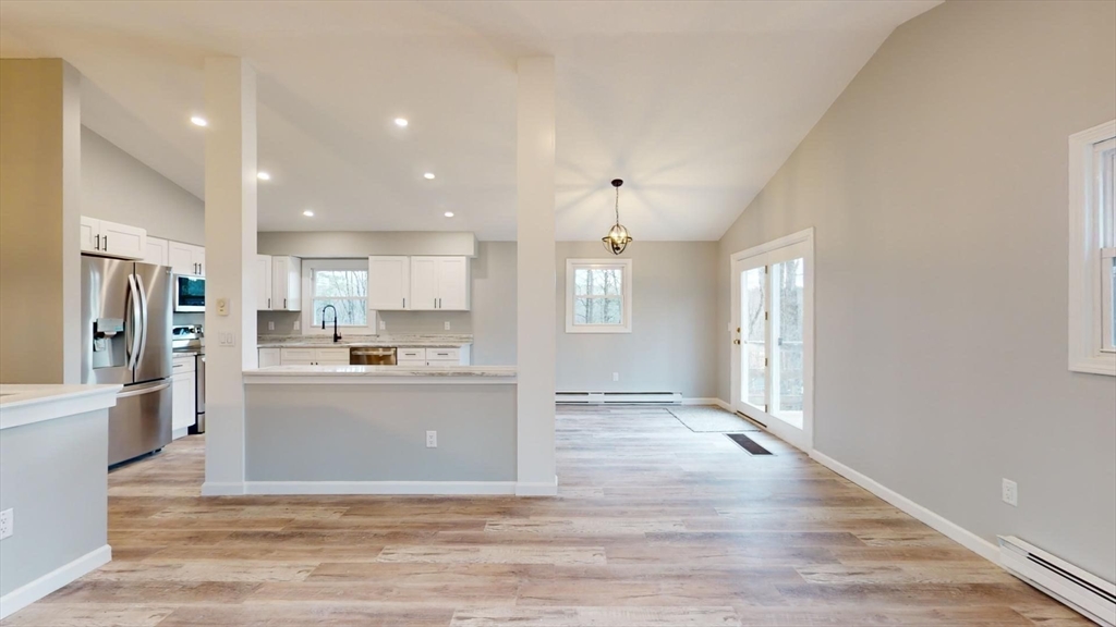 564 West Pelham Road Shutesbury, MA 01072 - Photo 20 of 40 a view of kitchen with wooden floor and electronic appliances