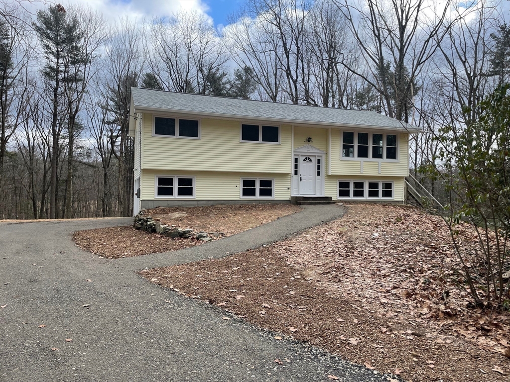 564 West Pelham Road Shutesbury, MA 01072 - Photo 2 of 40 a front view of a house with a yard