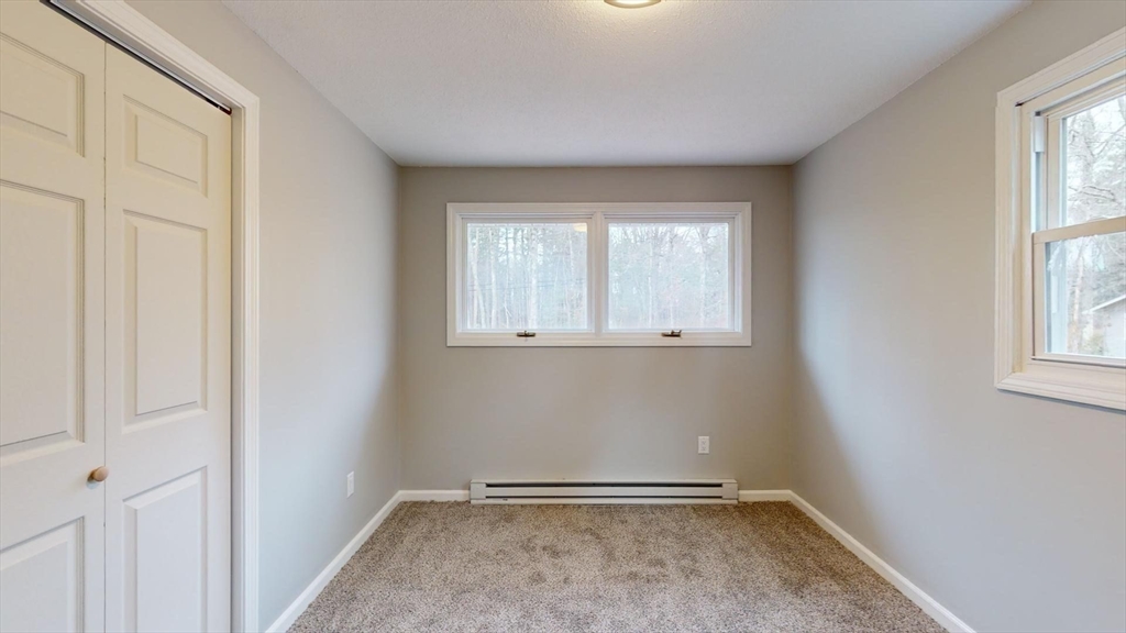 564 West Pelham Road Shutesbury, MA 01072 - Photo 30 of 40 an empty room with windows
