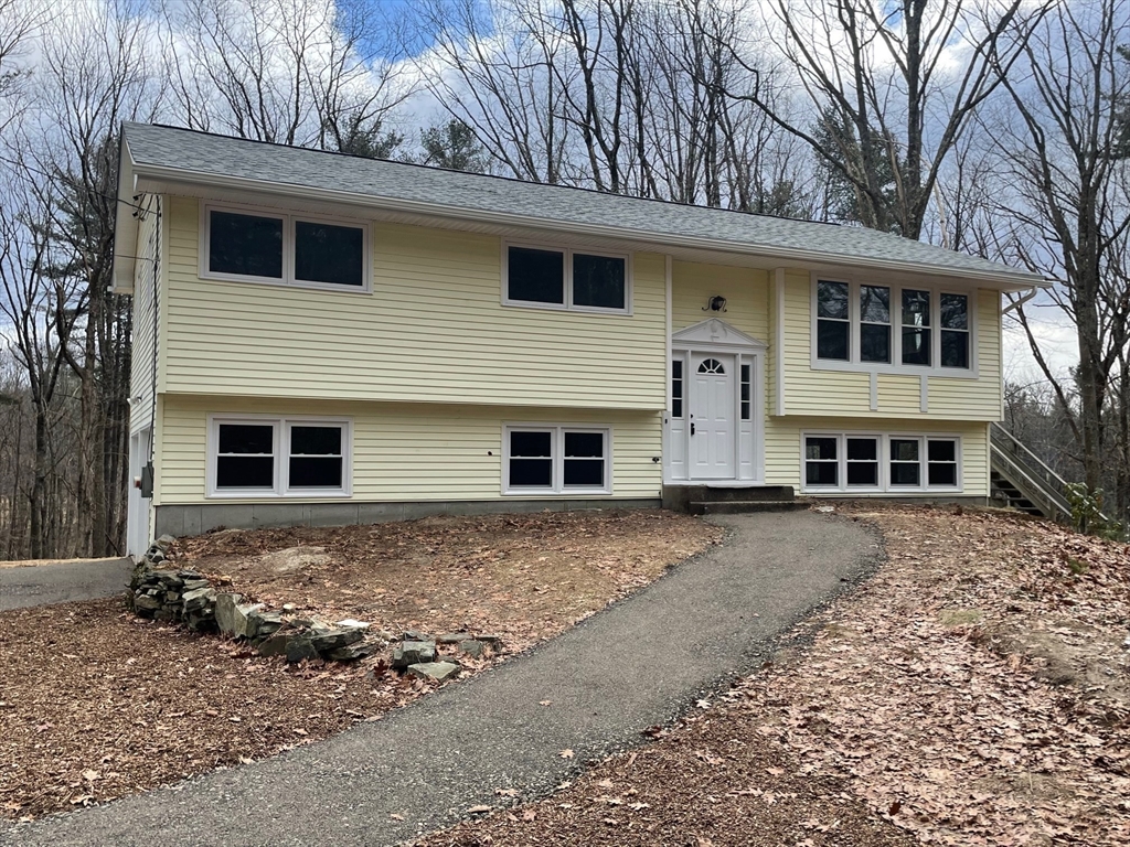 564 West Pelham Road Shutesbury, MA 01072 - Photo 3 of 40 a front view of a house with a yard