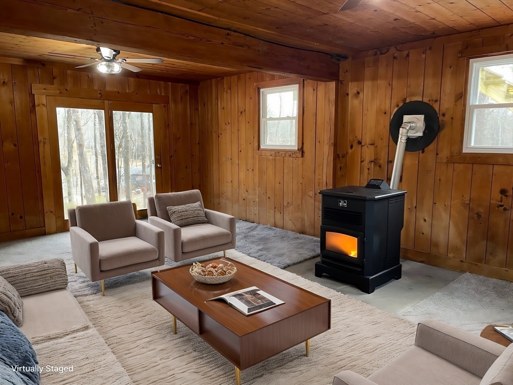 564 West Pelham Road Shutesbury, MA 01072 - Photo 33 of 40 a living room with furniture and a fireplace