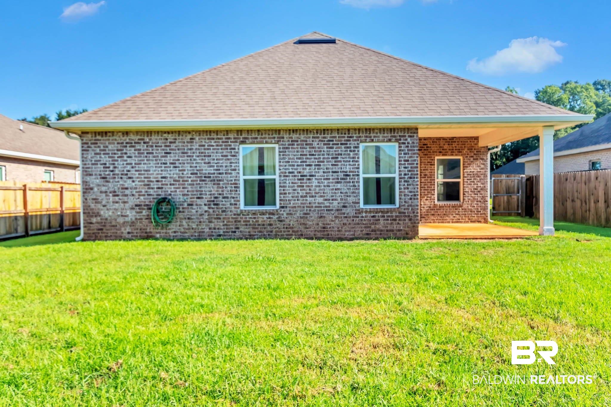 16461 Prado Loop Loxley, AL 36551 - Photo 57 of 78 Back of property featuring a fenced backyard, a patio area, brick siding, and a shingled roof