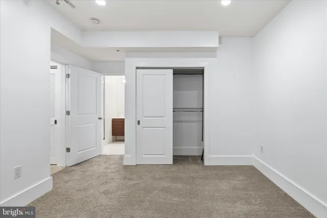 a bathroom with a sink vanity and toilet