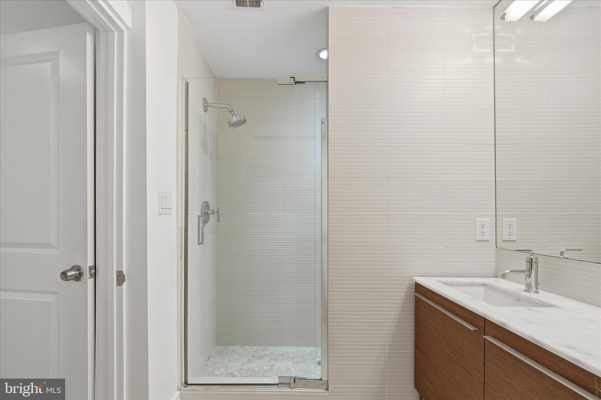 2818 Connecticut Avenue Northwest, Unit 5 Washington, DC 20008 - Photo 20 of 26 a bathroom with a sink and a mirror