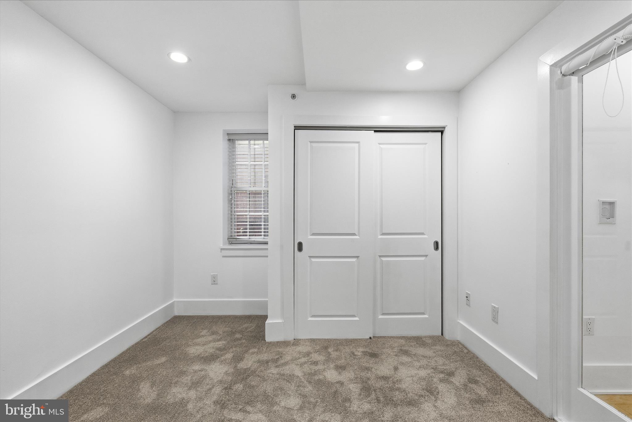 2818 Connecticut Avenue Northwest, Unit 5 Washington, DC 20008 - Photo 23 of 26 an empty room with windows and closet