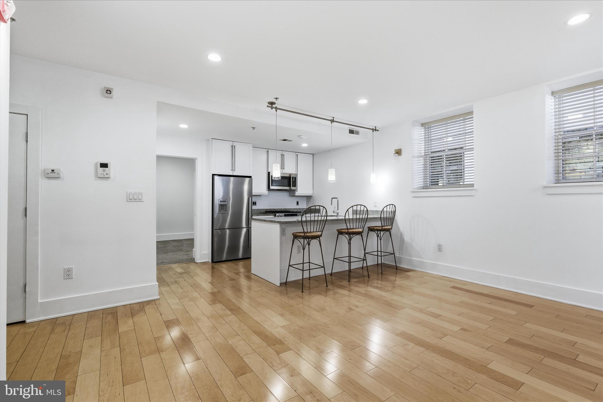 2818 Connecticut Avenue Northwest, Unit 5 Washington, DC 20008 - Photo 8 of 26 a kitchen with stainless steel appliances a refrigerator and a stove top oven