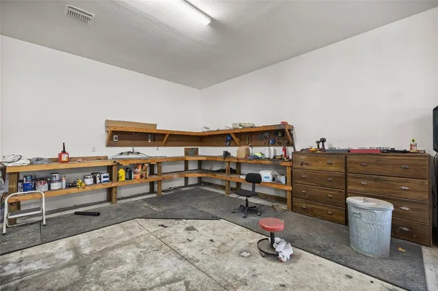 a reading room with furniture and book shelf