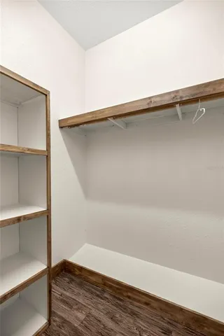 a view of an empty walk in closet