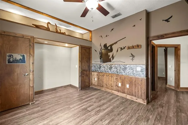 a view of hallway with wooden floor