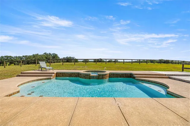 a view of a lake with houses in the back