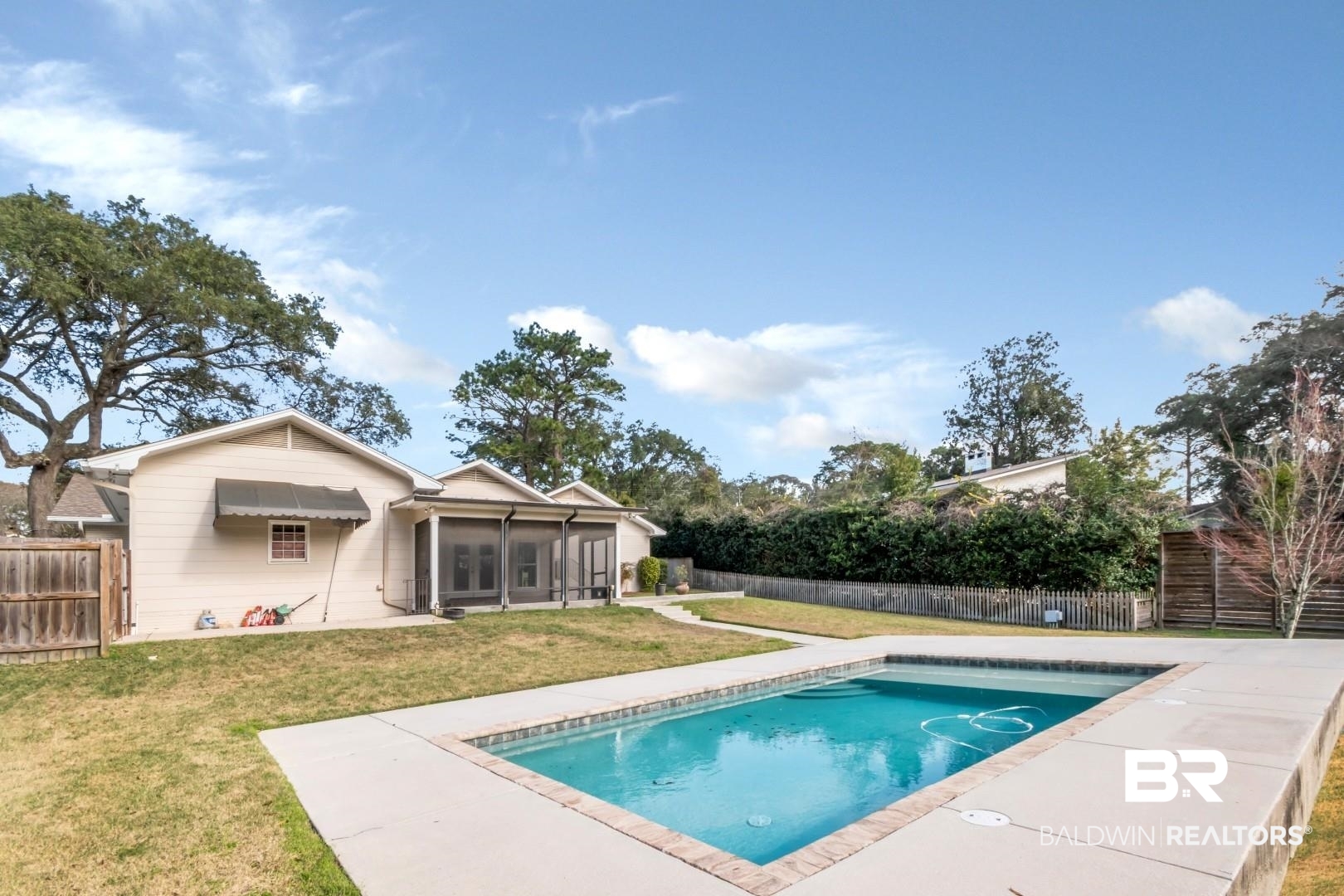 231 Rochester Road Mobile, AL 36608 - Photo 46 of 51 View of swimming pool with a fenced backyard, a sunroom, and patio surround