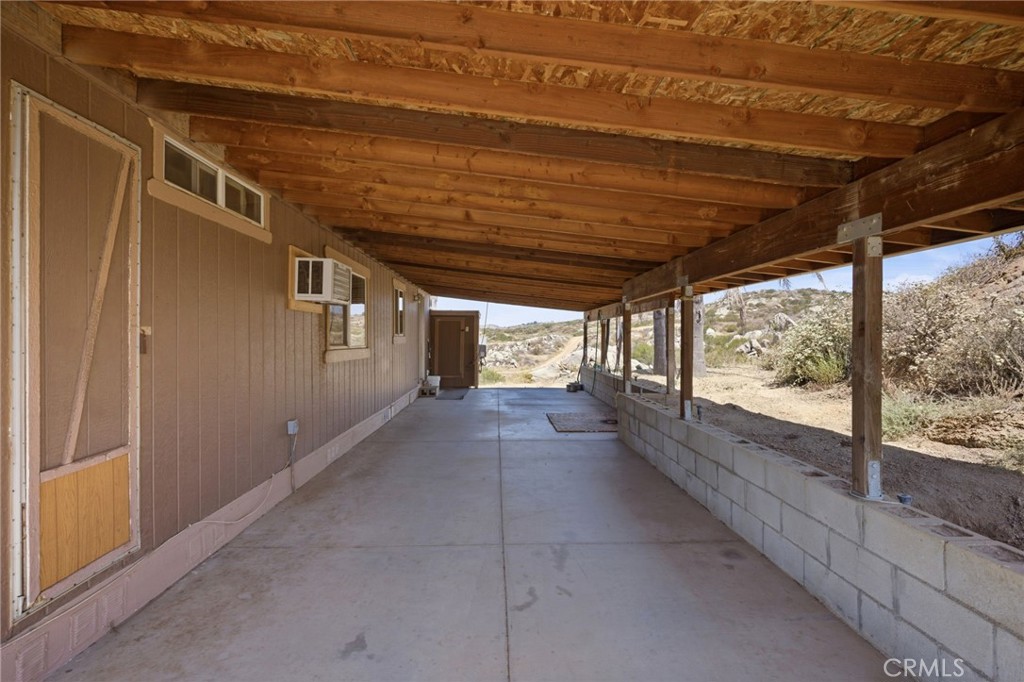 40100 Owl Valley Road Temecula, CA 92592 - Photo 36 of 44 a view of empty room with wooden floor and fan