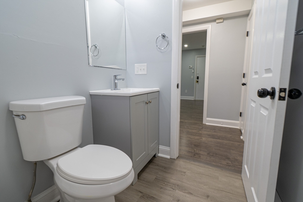 225 South Main Street, Unit 7 Haverhill, MA 01835 - Photo 12 of 27 a white toilet sitting next to a bathroom sink