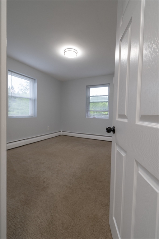 225 South Main Street, Unit 7 Haverhill, MA 01835 - Photo 13 of 27 an empty room with a empty space and windows