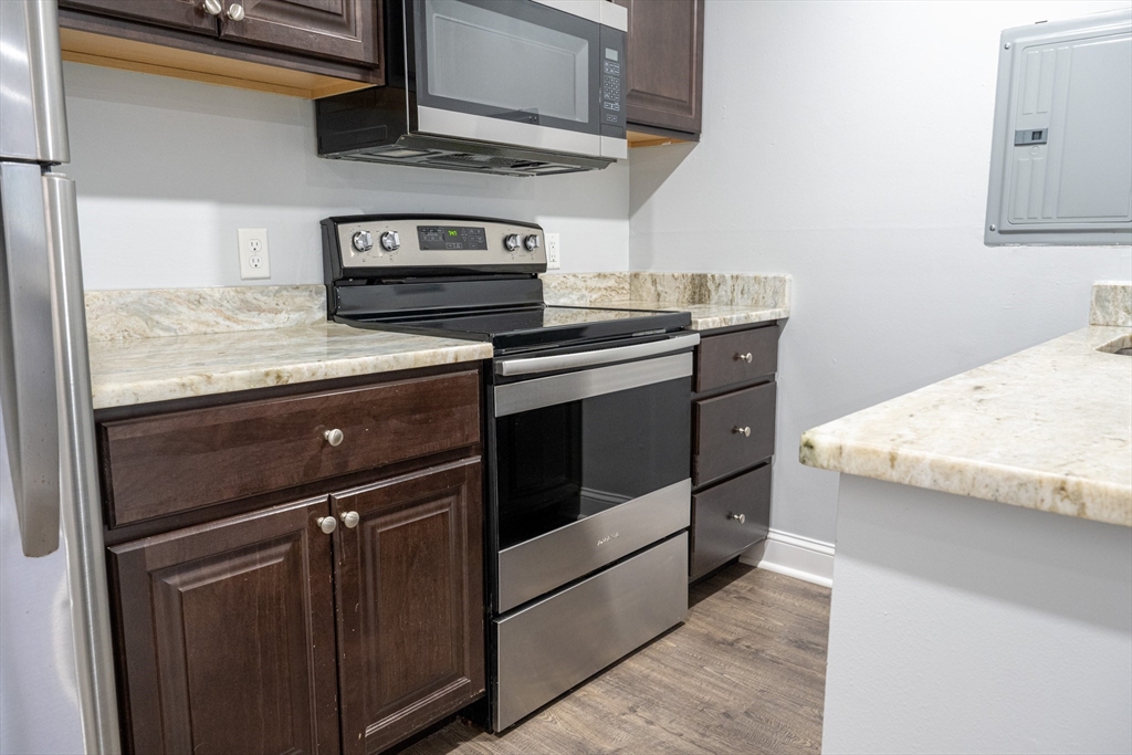 225 South Main Street, Unit 7 Haverhill, MA 01835 - Photo 7 of 27 a stove top oven sitting inside of a kitchen
