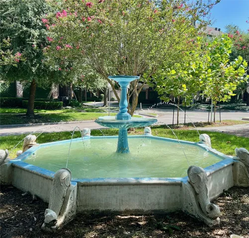 a view of a park with large trees